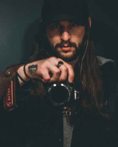 man holding DSLR camera