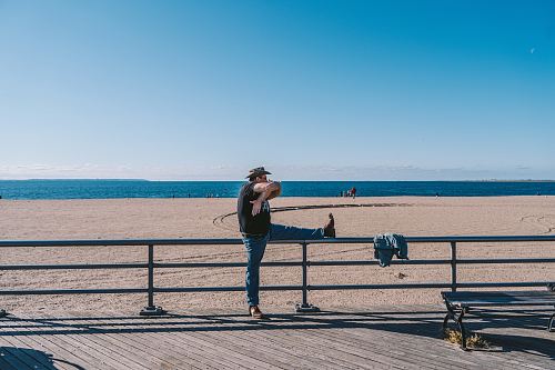 man leaning on railing