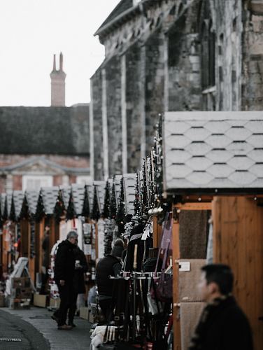 people in an area filled with store stalls