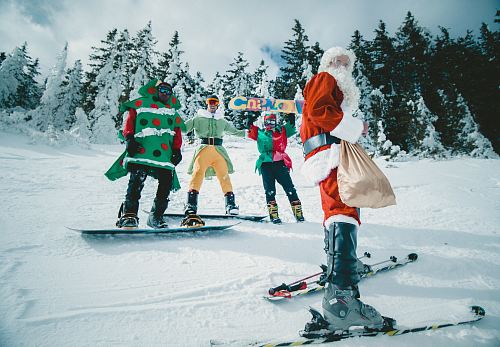 Santa Claus riding snowboard