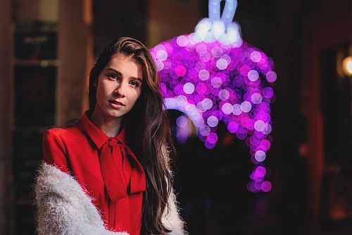 selective focus photo of woman wearing red collared top