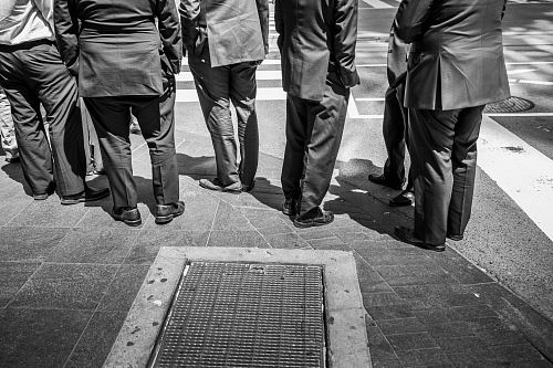 standing men in suit phto