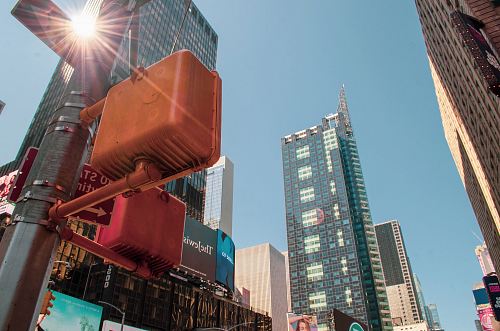 traffic signs near high-rise buildings