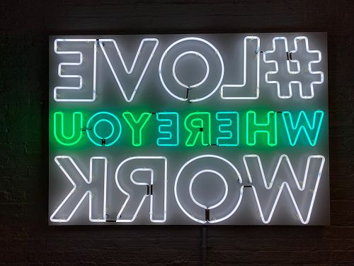 turned-on love where you work neon signage