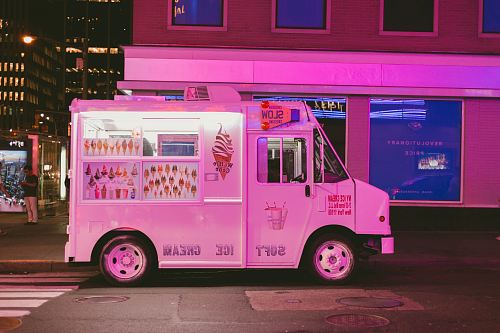 white ice cream truck parked on road