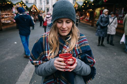 woman holding cup of coffee