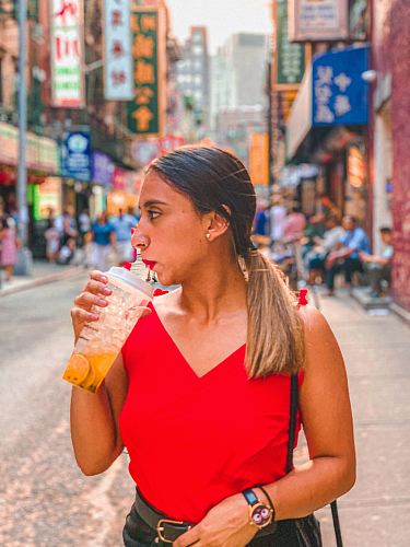 woman sipping drinking cup