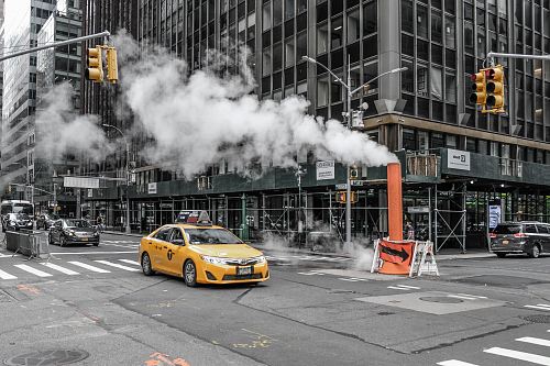 yellow car on road