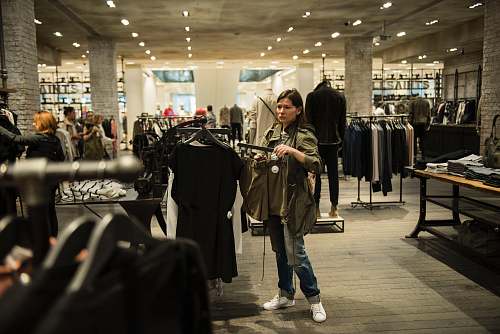 shoe woman holding apparel inside shopping building clothing