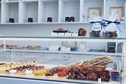 shop assorted-flavor of sweets inside glass serve over counter los angeles