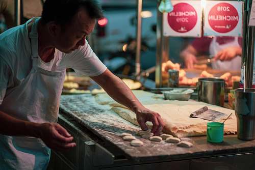 person man in white shirt doing dough human