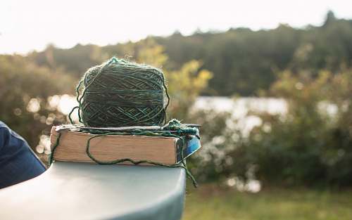 knitting green yard on white book yarn