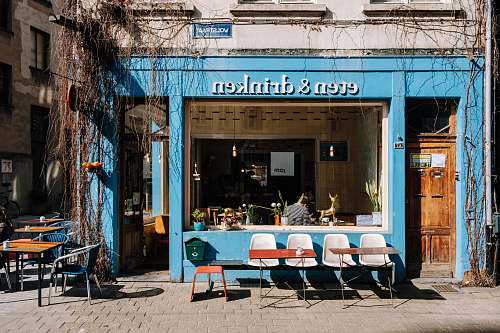 chair blue and white Eten & Drinken store front during daytime furniture