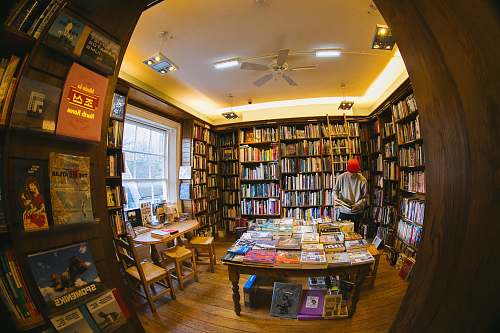 furniture peephole view of man inside library indoors