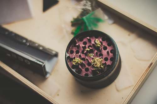 canabis red and black herb grinder ocb