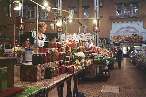 person man standing in front of table market