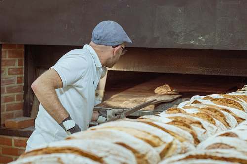person man wearing white polo shirt bakery