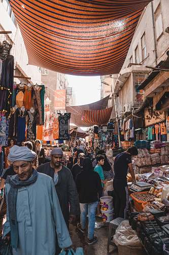 person people between vendors market