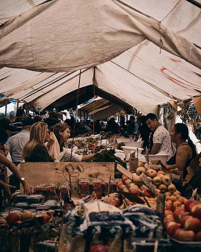 person people in market at daytime tent