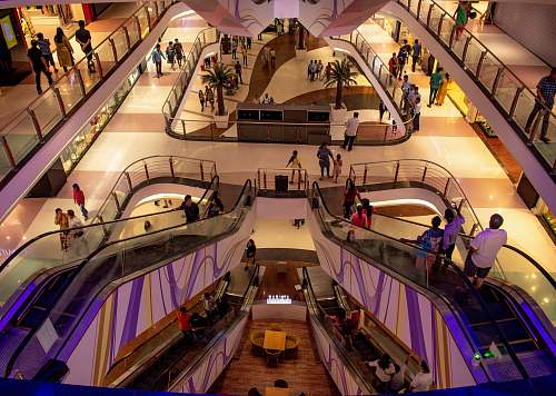 person people inside mall handrail