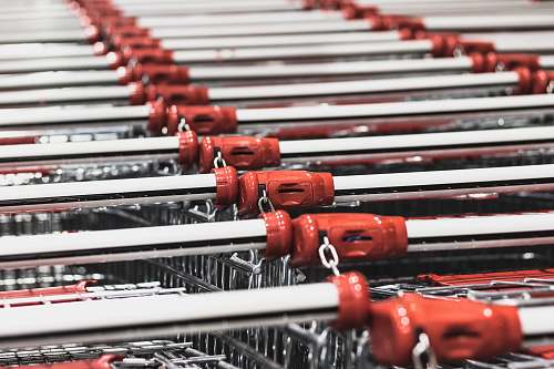 person photo of stacked shopping carts people