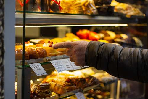 person sweet pastries shop