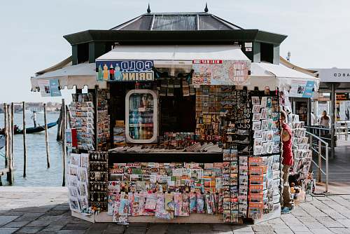 person white stall beside sea shop