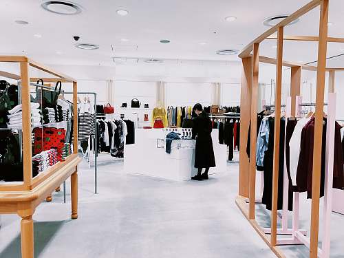 shop woman standing inside clothing area boutique