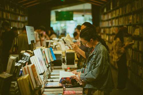 bookstore people standing and reading books book