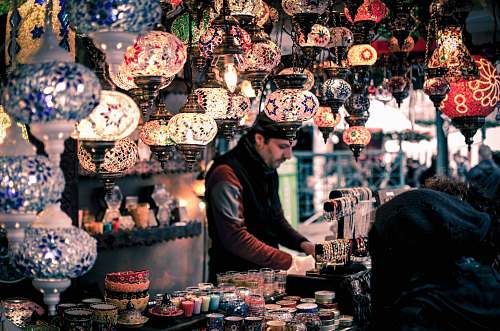 human man wearing red and black jacket market