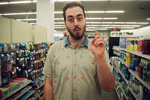 human man wearing teal and gray polo shirt shop