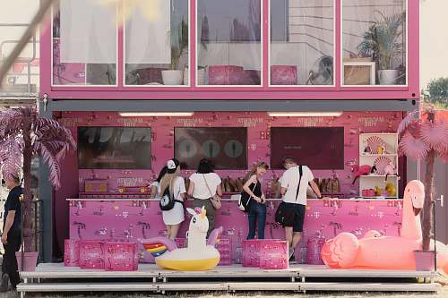 human people standing beside store shop