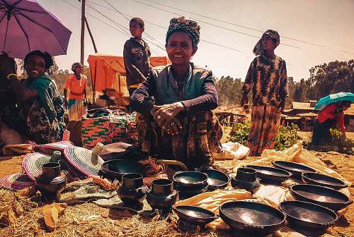 human woman sitting in front of bowls market