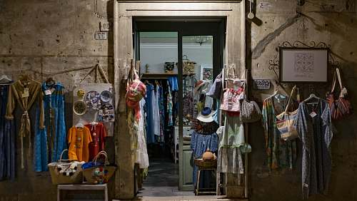 apparel assorted clothes hanging in front of store clothing