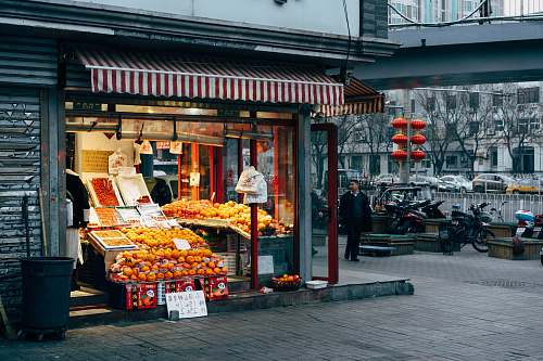 human assorted fruits display on store person