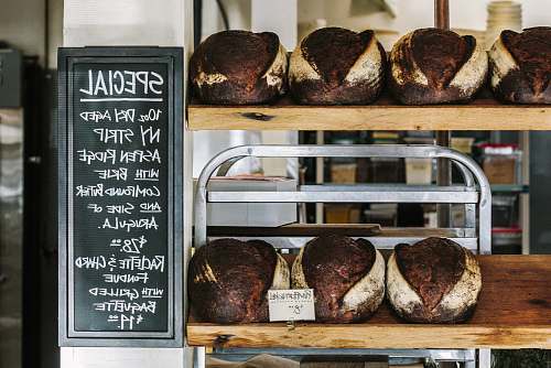 bread breads on brown wooden shelf bakery