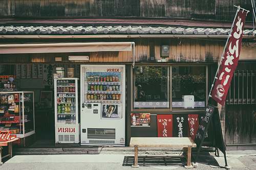 japan Kirin vending machine near glass display counter bench