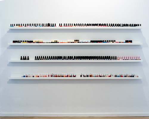 shelf nail polish bottles on rack grey