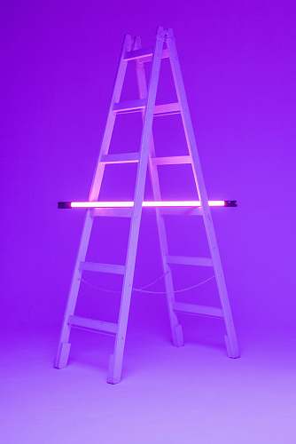 stand turned-on fluorescent lamp on folding ladder chair