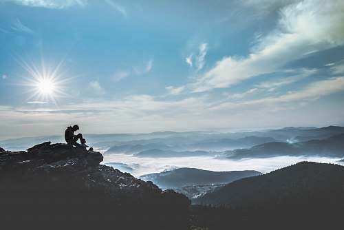nature man sitting on rock during daytime romania