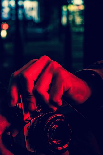 a man taking a photo of a woman with a camera