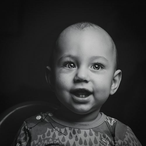 baby's crew-neck top grayscale photo