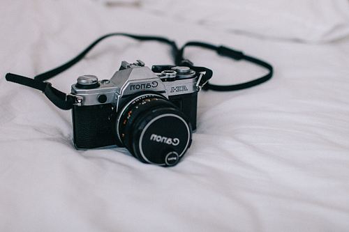 black and silver Canon DSLR camera