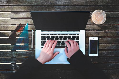 flat-lay photography of person about to use laptop computer