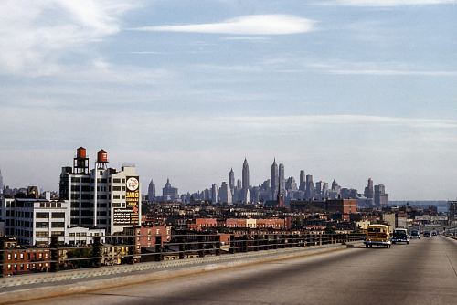landscape photo of buildings near fly over during daytime