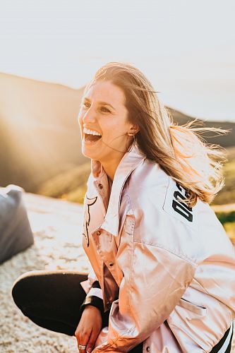 laughing woman while squatting