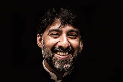 man wearing black and white top