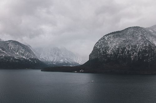 mountain surrounded by body of water