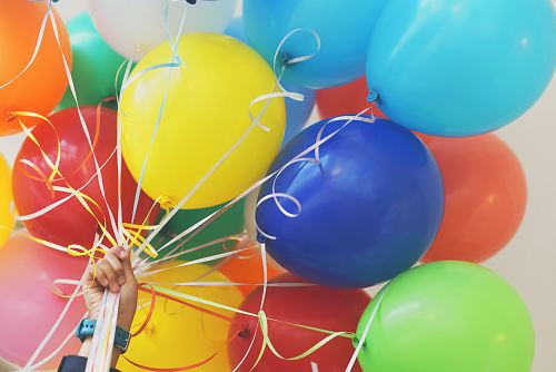person holding balloons