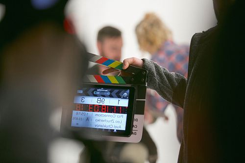 person holding clapperboard